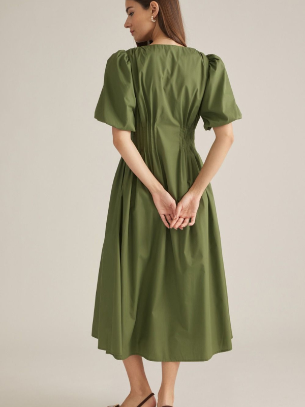 woman wearing an olive midi dress 