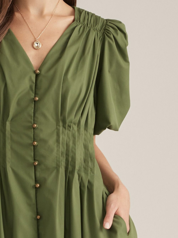 woman wearing an olive midi dress 
