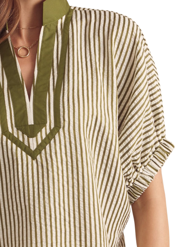 Striped shirt with green accents on a white background