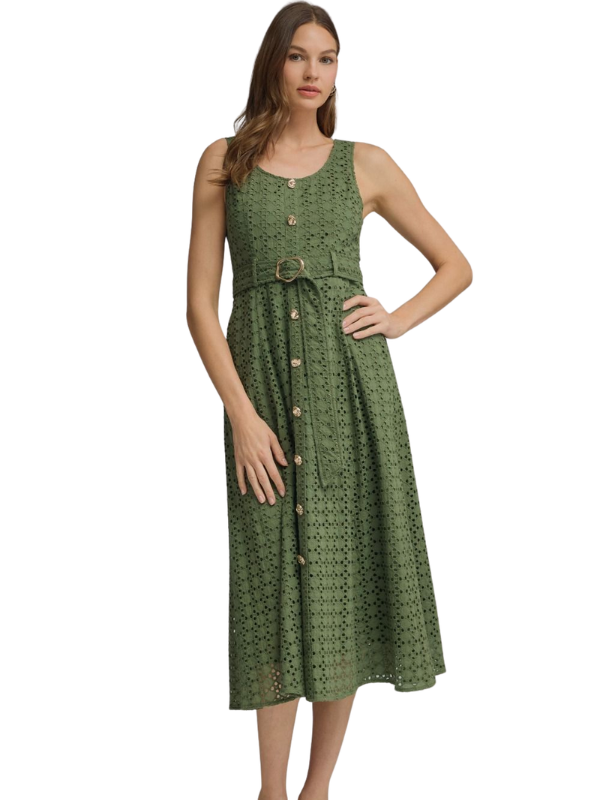 Woman wearing a green dress with a belt on a white background