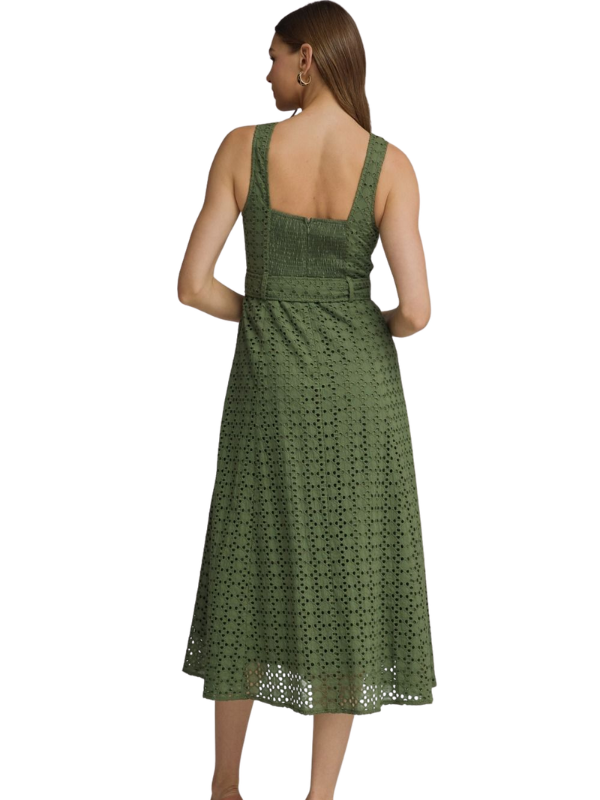 Green lace dress worn by a model on a white background