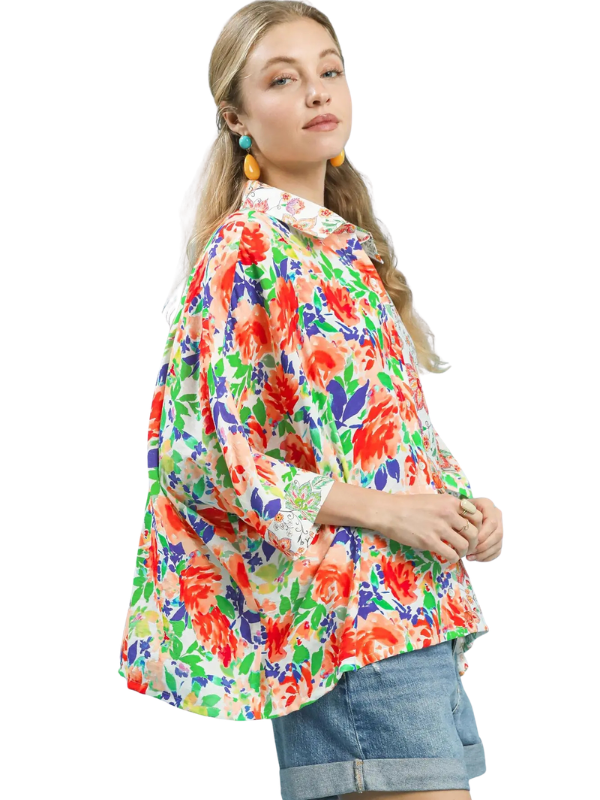 woman wearing floral collared top 