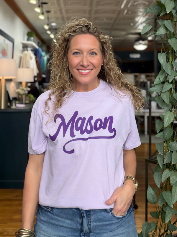woman wearing a lilac tee that says Mason in dark purple ink 