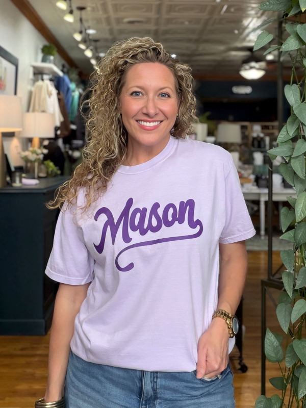 woman wearing a lilac tee that says Mason in dark purple ink 