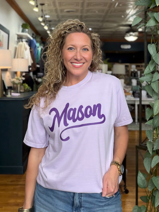 woman wearing a lilac tee that says Mason in dark purple ink 