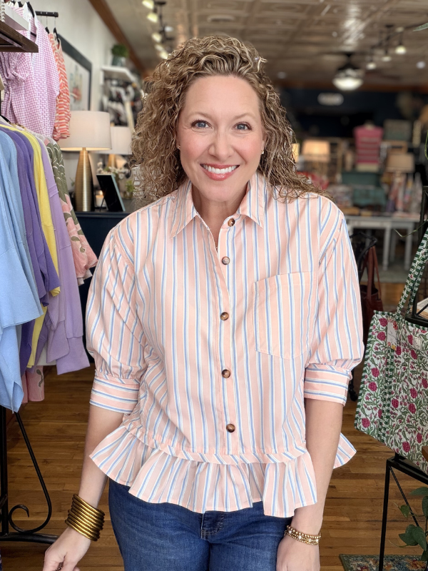 Woman wearing a striped shirt in a clothing store