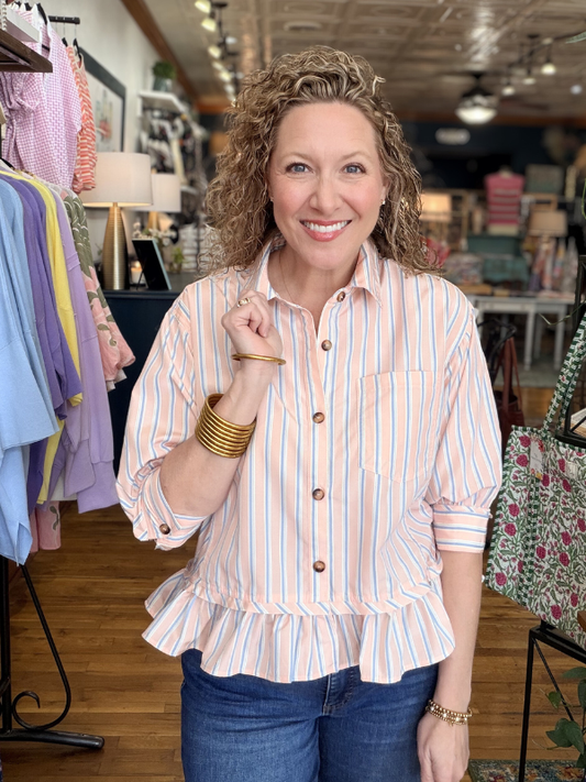 Woman wearing a striped shirt in a clothing store