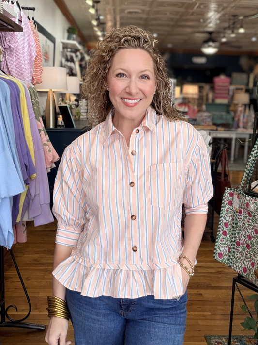 Woman wearing a striped shirt in a store setting