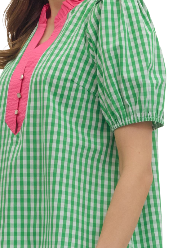Green and white checkered shirt with pink collar on a person