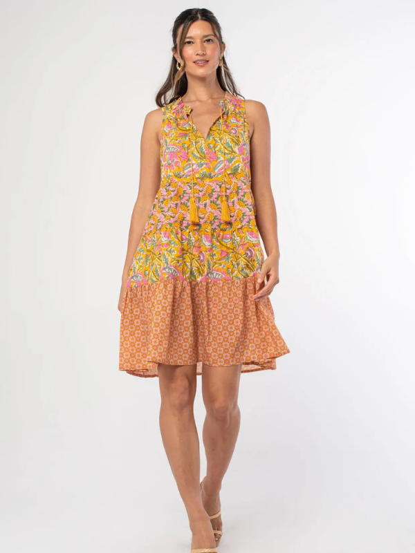 Woman wearing a floral dress with a white background