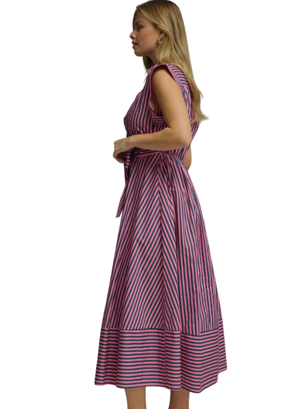Woman wearing a striped dress on a white background