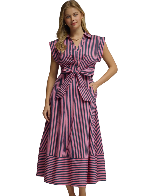 Woman wearing a striped dress on a white background