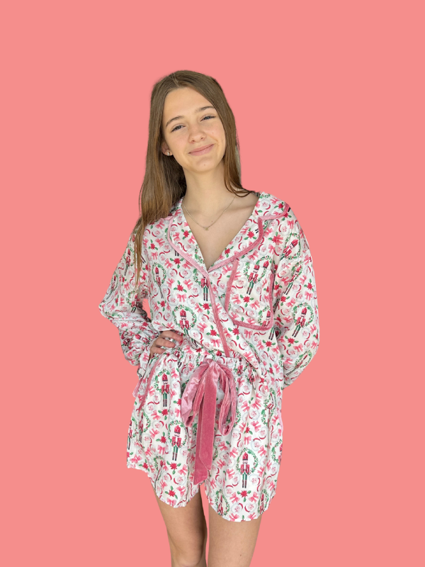Woman wearing a floral dress with a pink background
