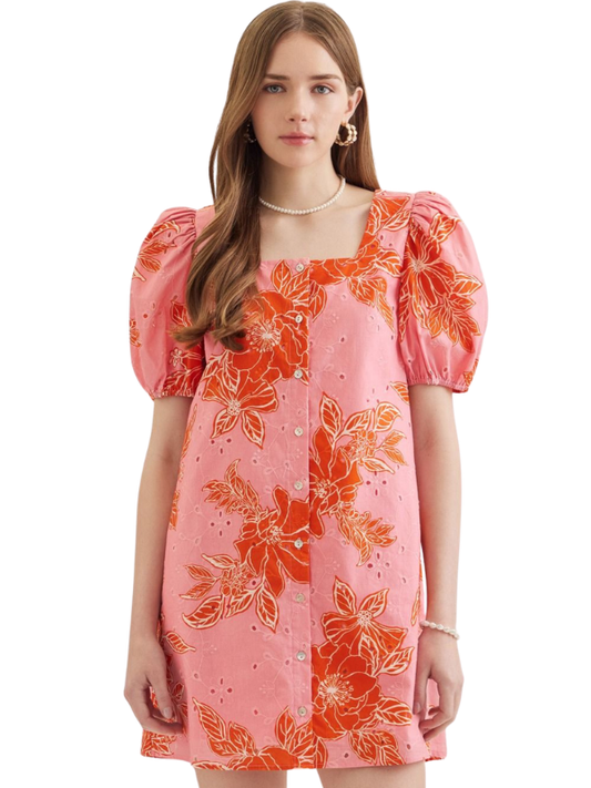woman wearing a pink and orange floral mini dress