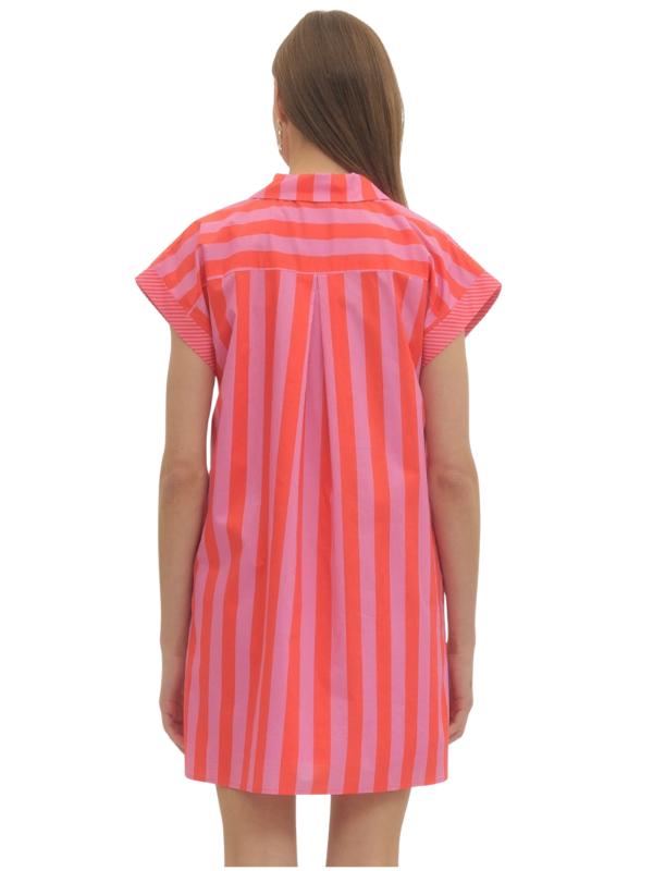 Woman wearing a red and white striped dress on a white background