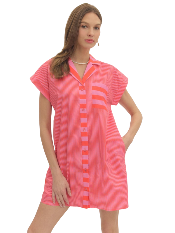 Woman wearing a pink dress with a white background