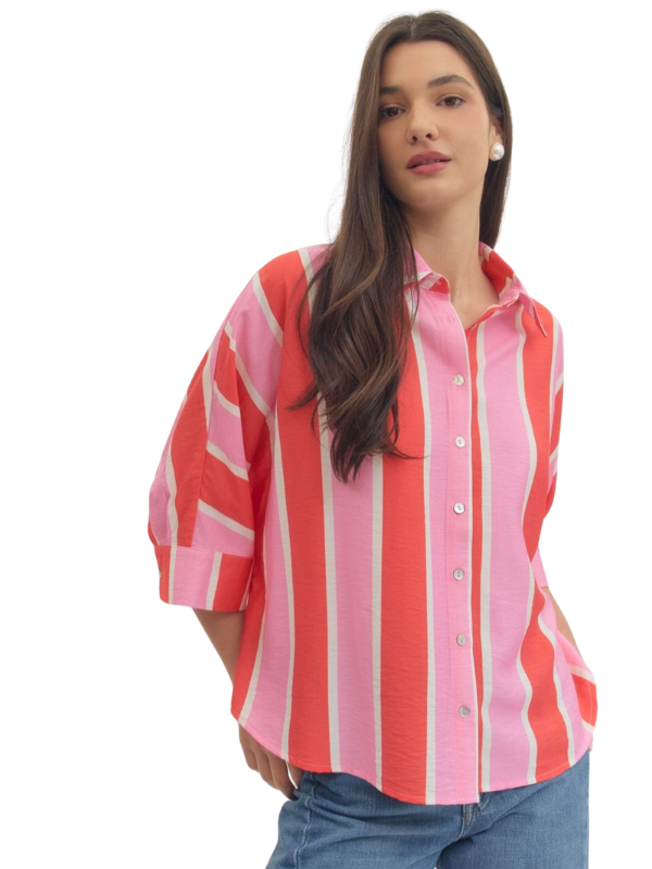 woman wearing a pink and orange striped button up top 