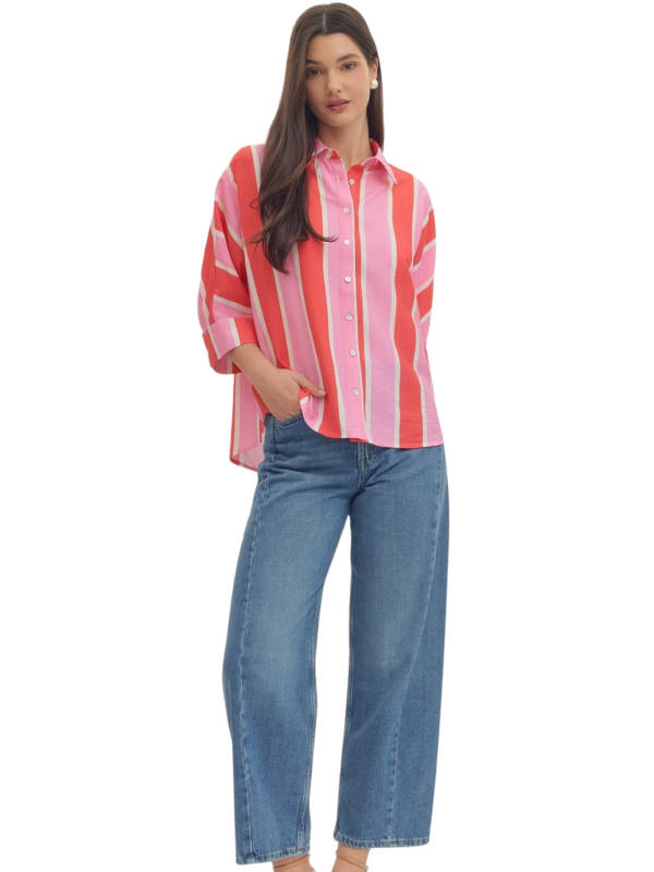 woman wearing a pink and orange striped button up top 