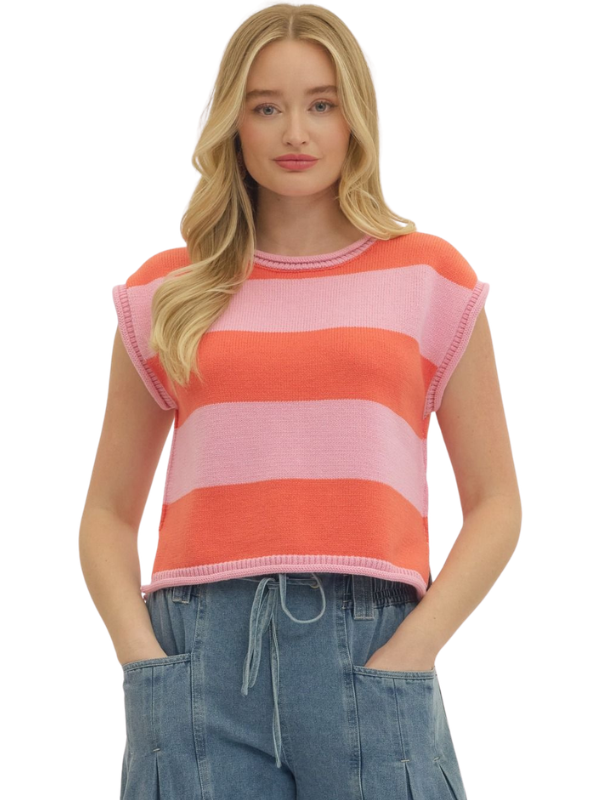 Woman wearing a sleeveless striped top with pink and orange horizontal stripes on a white background