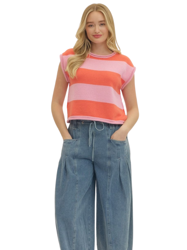 Woman wearing a striped shirt and jeans on a white background