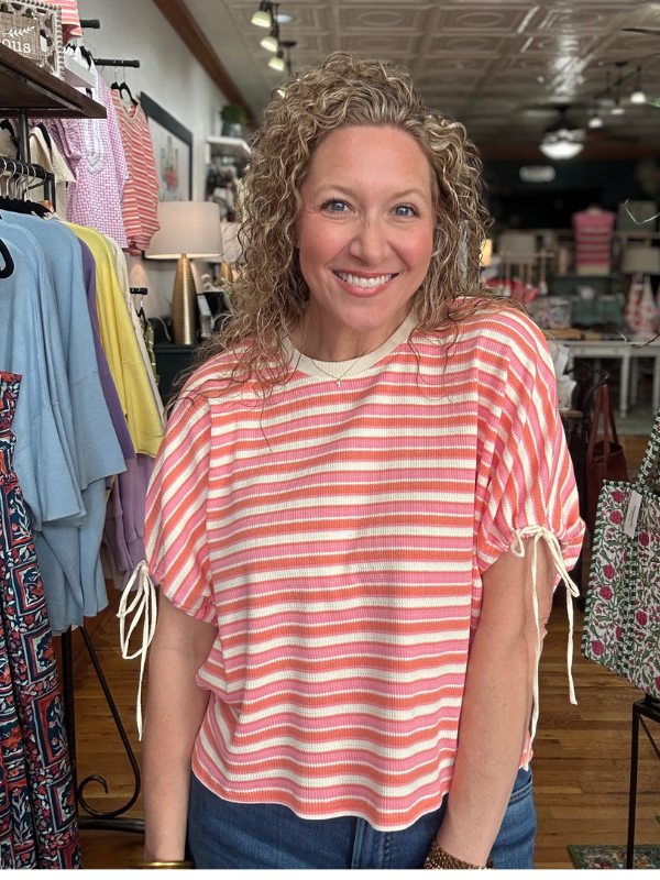 Woman wearing a striped shirt in a clothing store