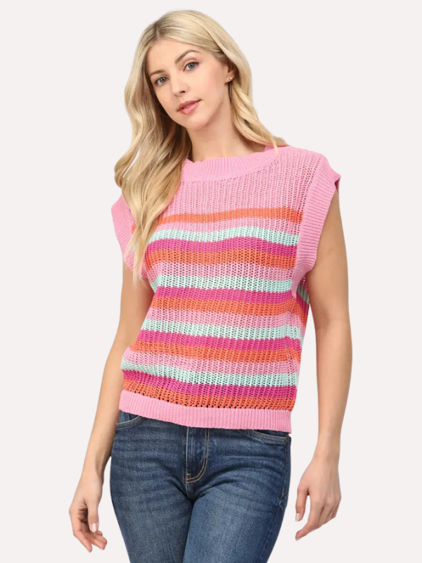 Woman wearing a colorful striped sleeveless sweater on a white background