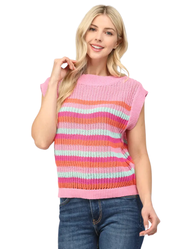 Woman wearing a colorful striped sleeveless sweater on a white background