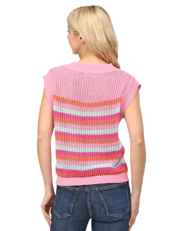 Woman wearing a colorful striped sleeveless top on a white background