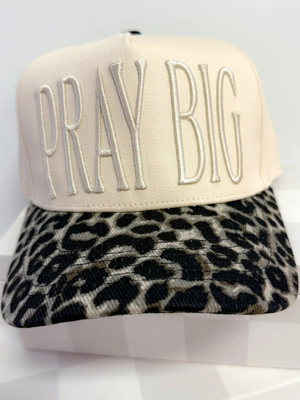 Cap with 'PRAY BIG' text on a white background