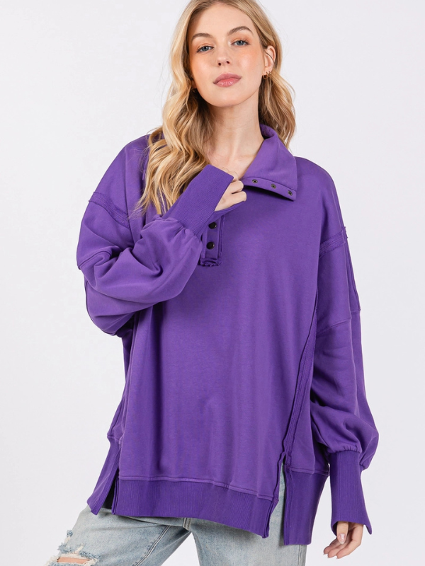 Woman wearing a purple sweater on a white background