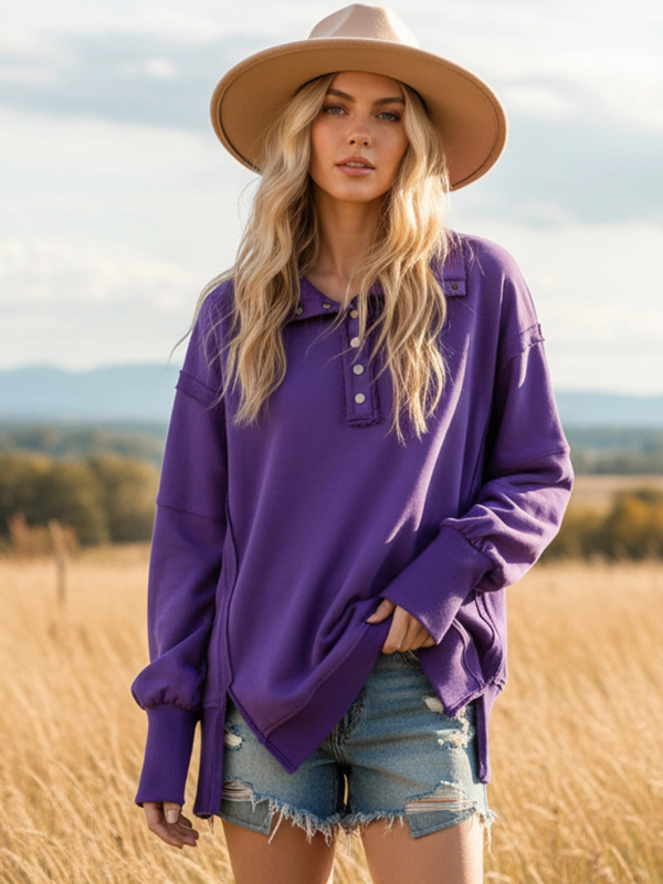 Woman wearing a purple shirt and beige hat in a field