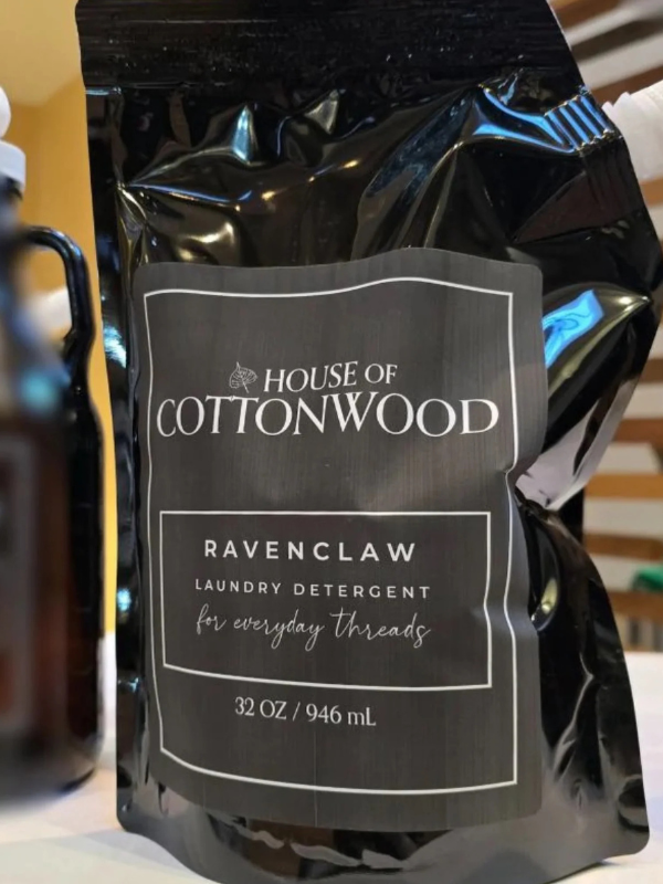 Black bag of House of Cottonwood Ravenclaw laundry detergent with a label.