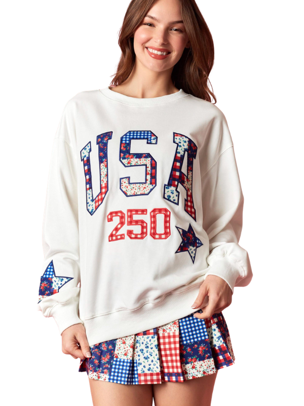 woman wearing a USA sweatshirt and matching skort 