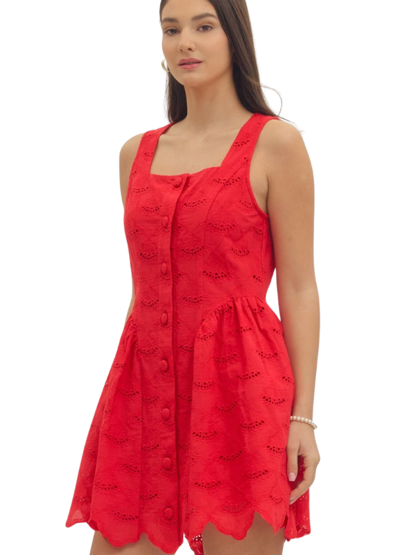 Woman wearing a red dress with a white background