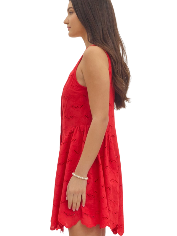 Woman wearing a red dress with a white background