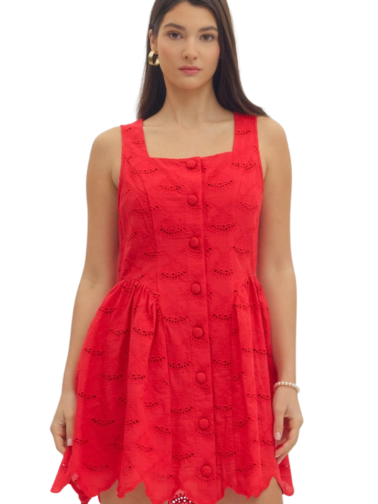 Woman wearing a red dress with a white background
