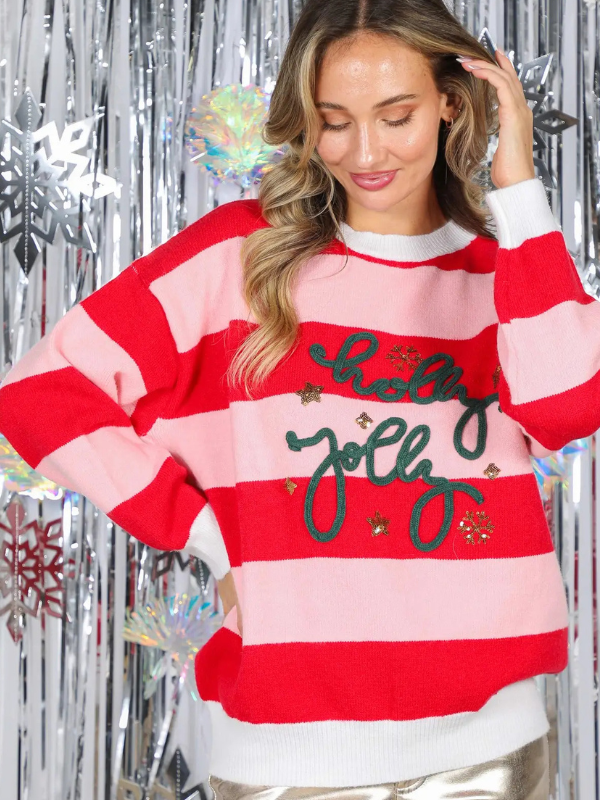 woman wearing a Pink + Red Holly Jolly Sweater