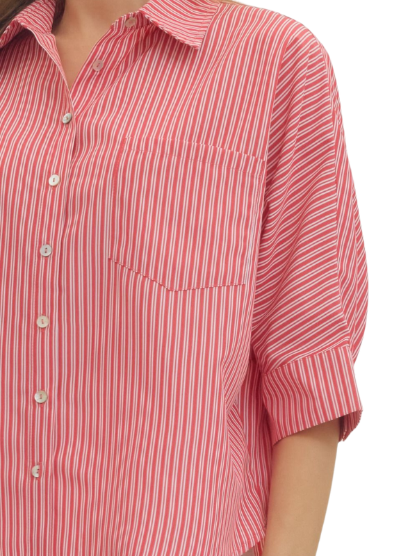 woman wearing a red and whtie striped top 