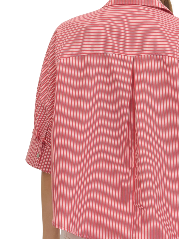 woman wearing a red and whtie striped top 