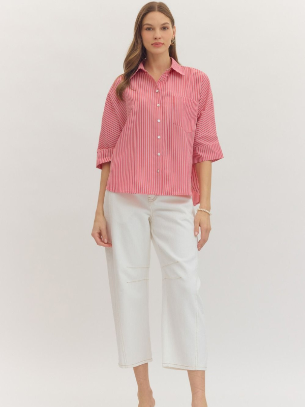 woman wearing a red and whtie striped top 