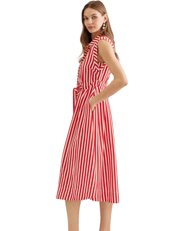 Woman wearing a red and white striped dress on a white background