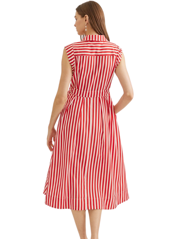 Woman wearing a red and white striped dress on a white background