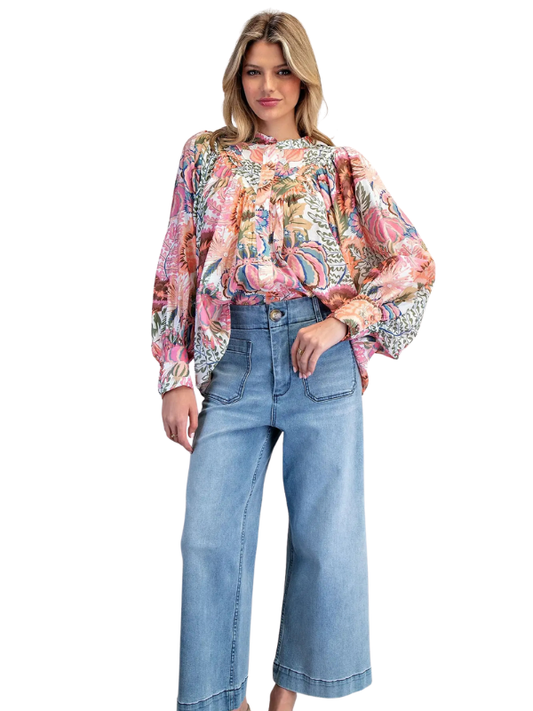 woman wearing long sleeve floral top 