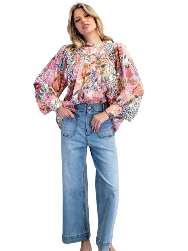 woman wearing long sleeve floral top 