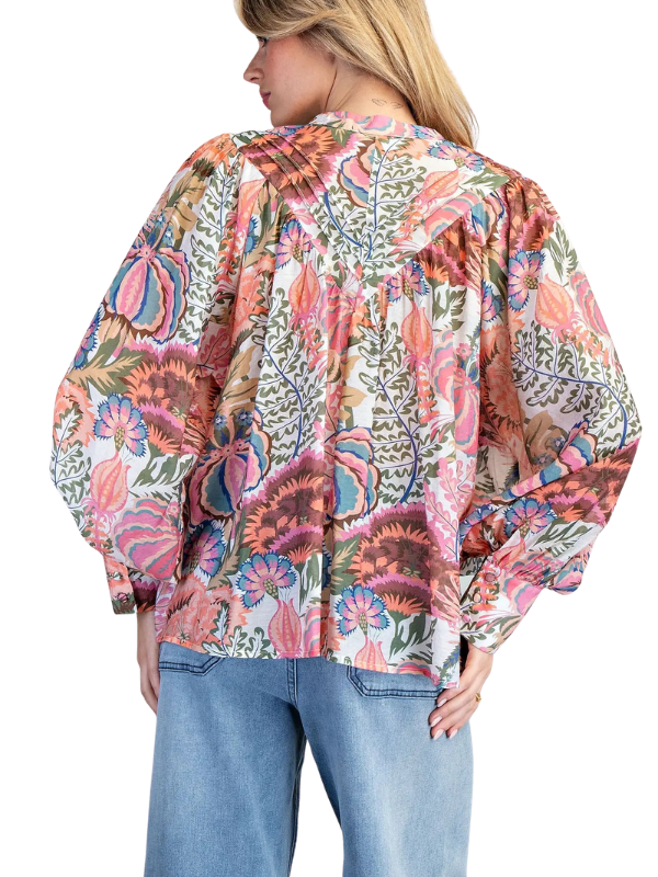 woman wearing long sleeve floral top 