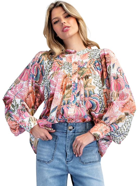 woman wearing long sleeve floral top 