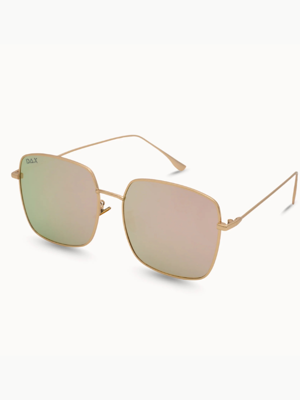 Gold-framed sunglasses with pink-tinted lenses on a white background