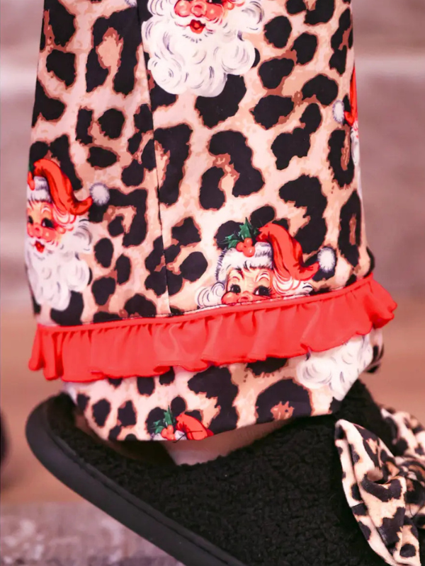 woman wearing Santa Safari Chic Ruffle Pajama Set