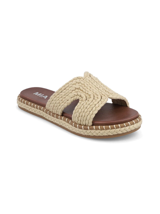 Beige braided sandal with brown sole on a white background