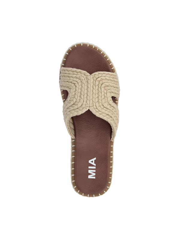 Beige sandal with brown sole on a white background